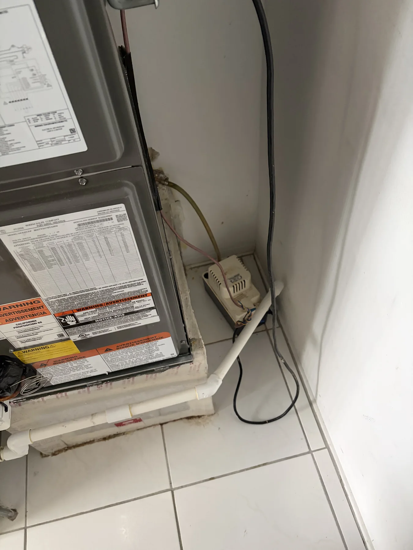 Condensate pump service shown in an HVAC job photo