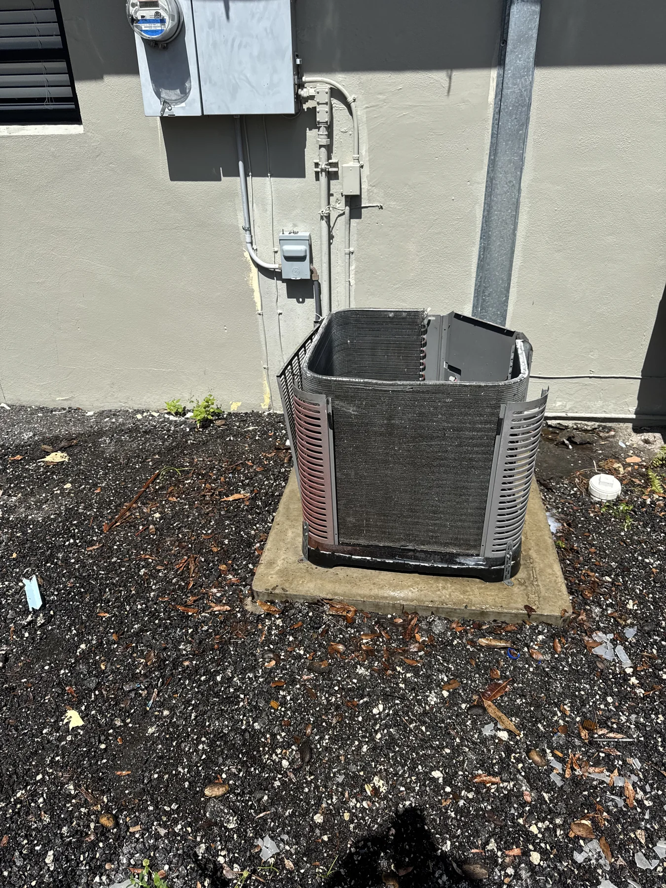 Outdoor condenser cleaning shown in a service photo